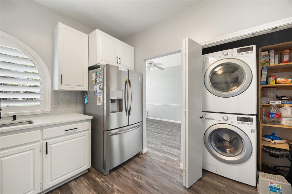 2016 Falcon Ridge Drive, Unit B Carrollton, TX 75010 - Photo 6 of 11 Laundry area with dark wood finished floors, stacked washer / drying machine, and a ceiling fan
