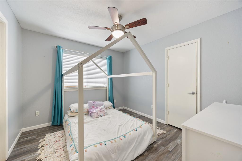 2016 Falcon Ridge Drive, Unit B Carrollton, TX 75010 - Photo 10 of 11 Bedroom with ceiling fan and dark wood-style floors