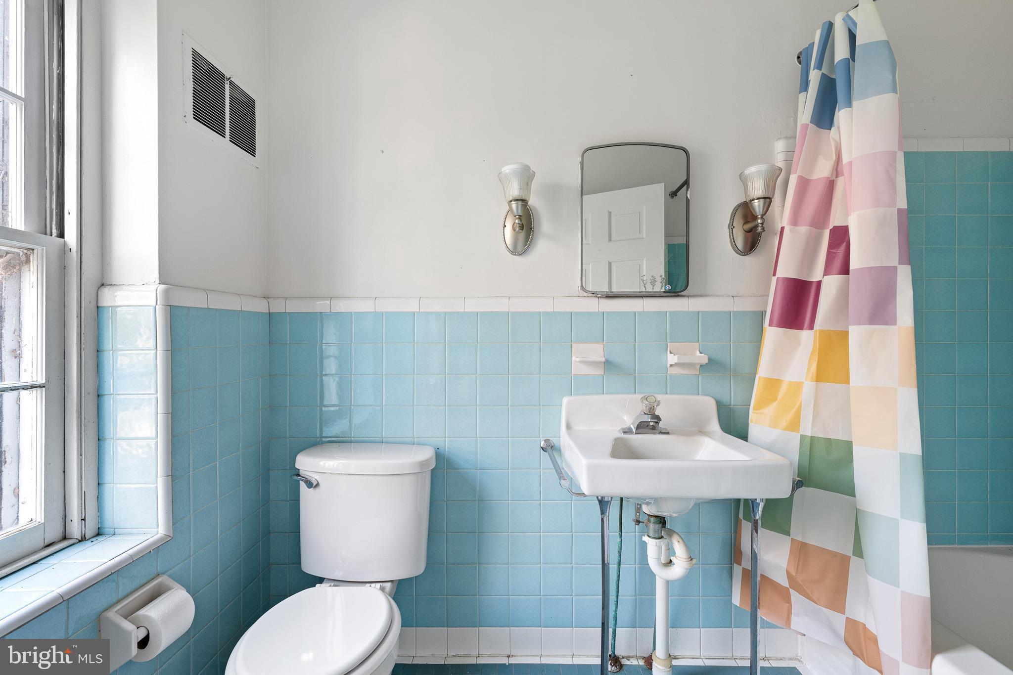 547 Concord Road Glen Mills, PA 19342 - Photo 21 of 42 a bathroom with a toilet sink and mirror