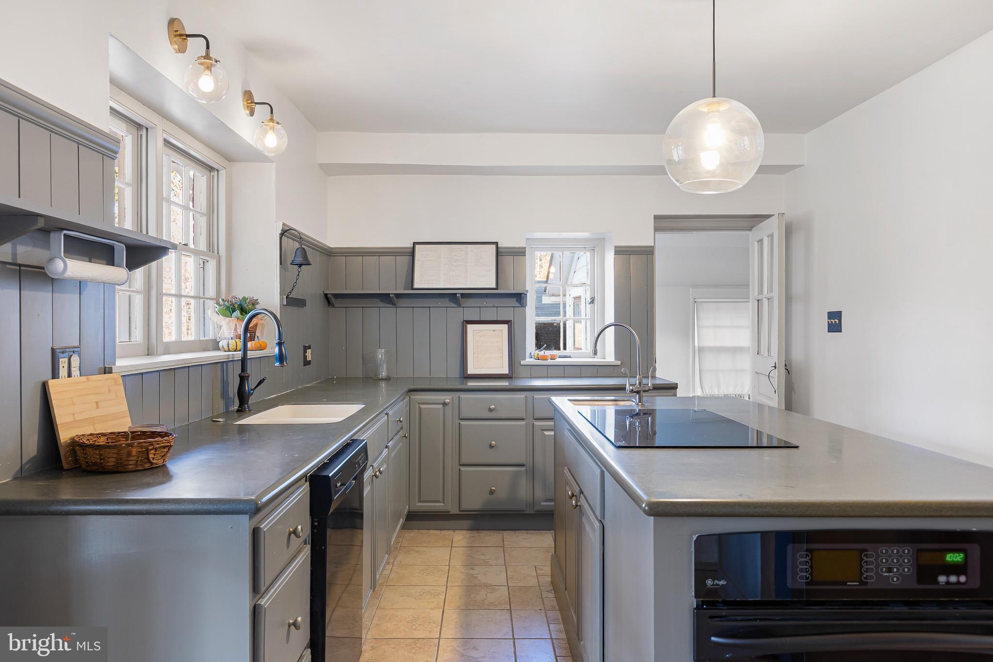 547 Concord Road Glen Mills, PA 19342 - Photo 30 of 42 a kitchen with granite countertop a sink and cabinets