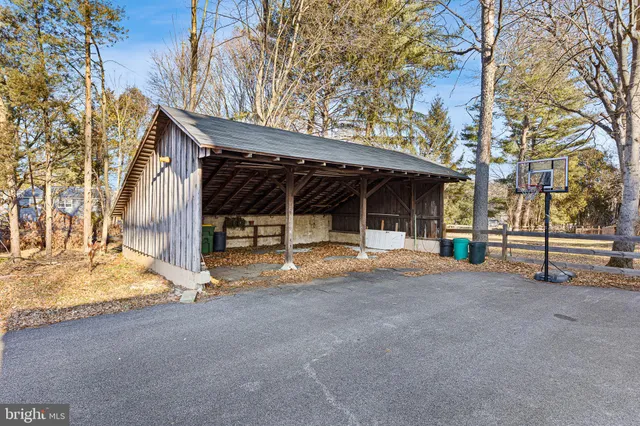 a view of a house with a patio and a yard