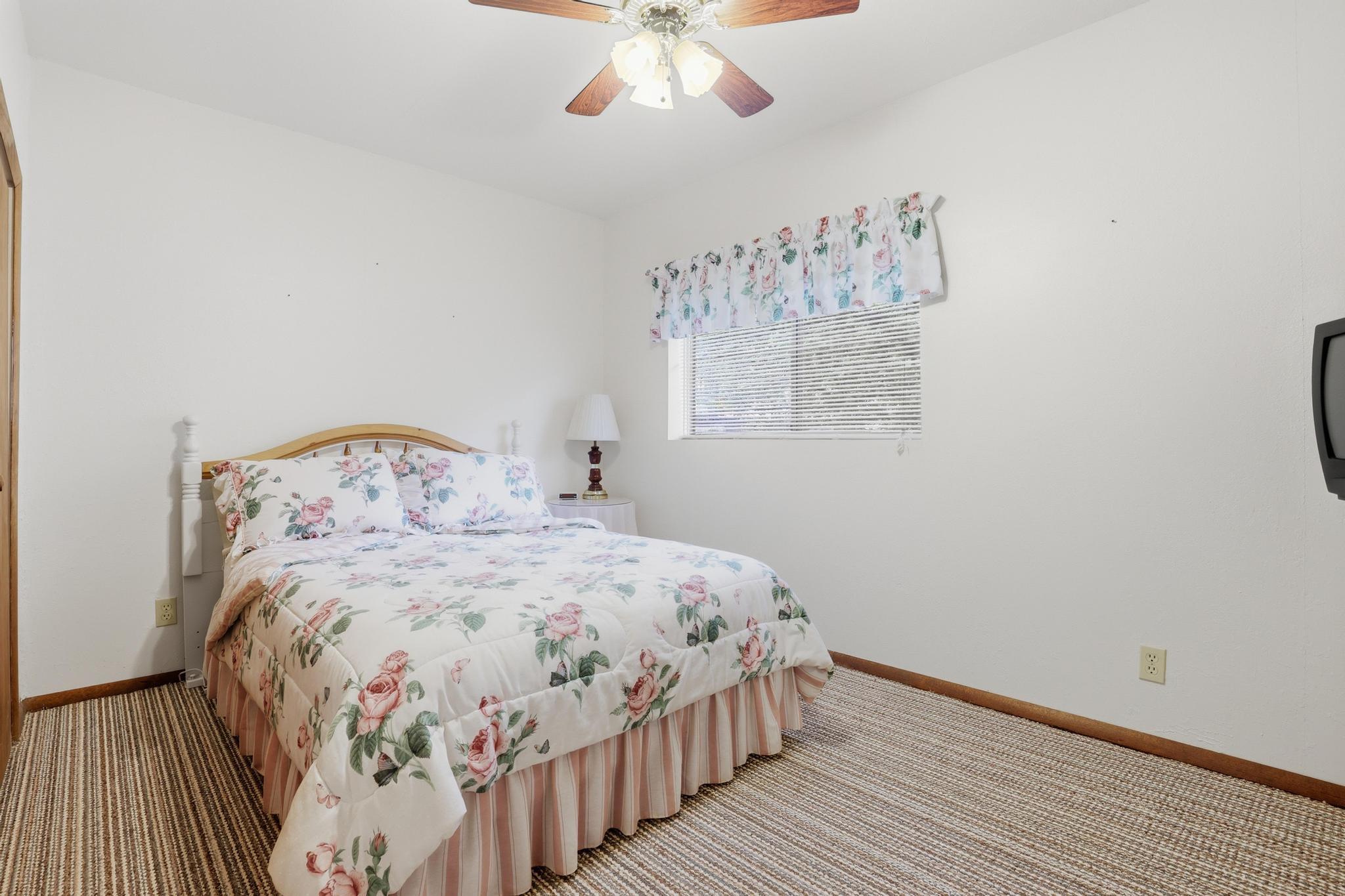 223 Thompson Road Payson, AZ 85541 - Photo 16 of 22 a bedroom with a bed and wooden floor
