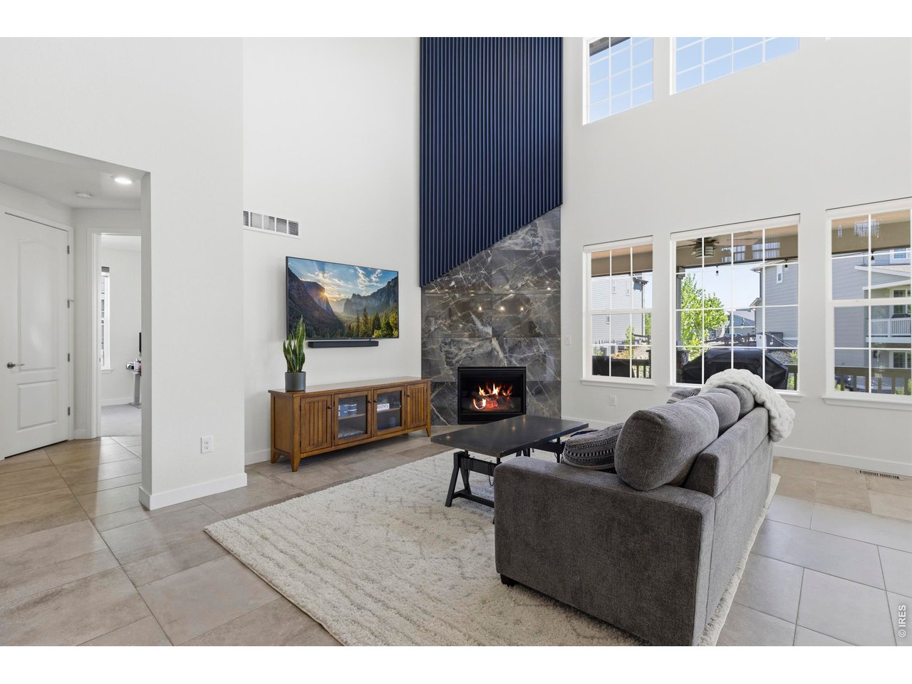 2910 Water View Street Timnath, CO 80547 - Photo 7 of 50 a living room with furniture and a fireplace