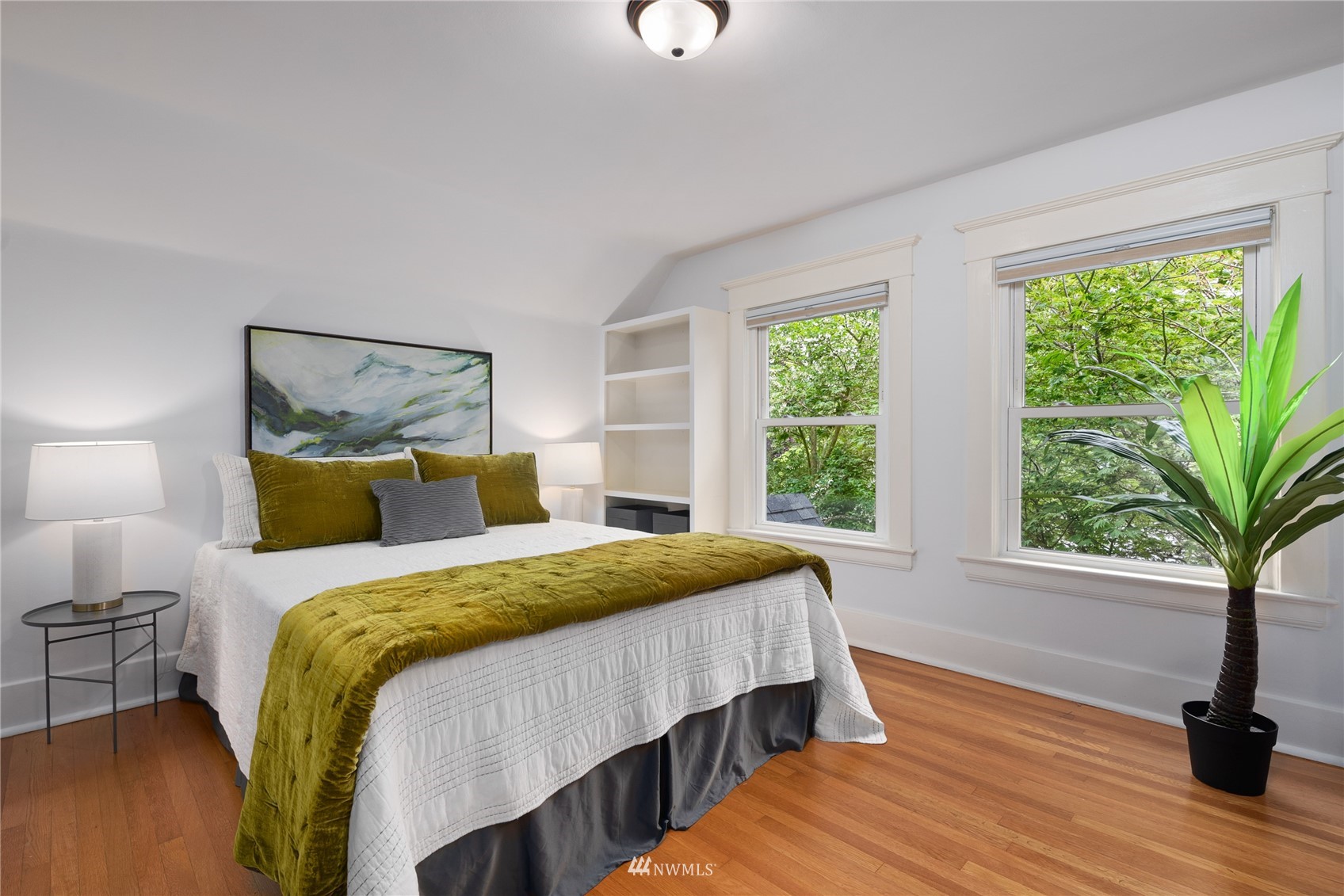 2419 2nd Avenue West Seattle, WA 98119 - Photo 12 of 30 a bedroom with a bed and a window