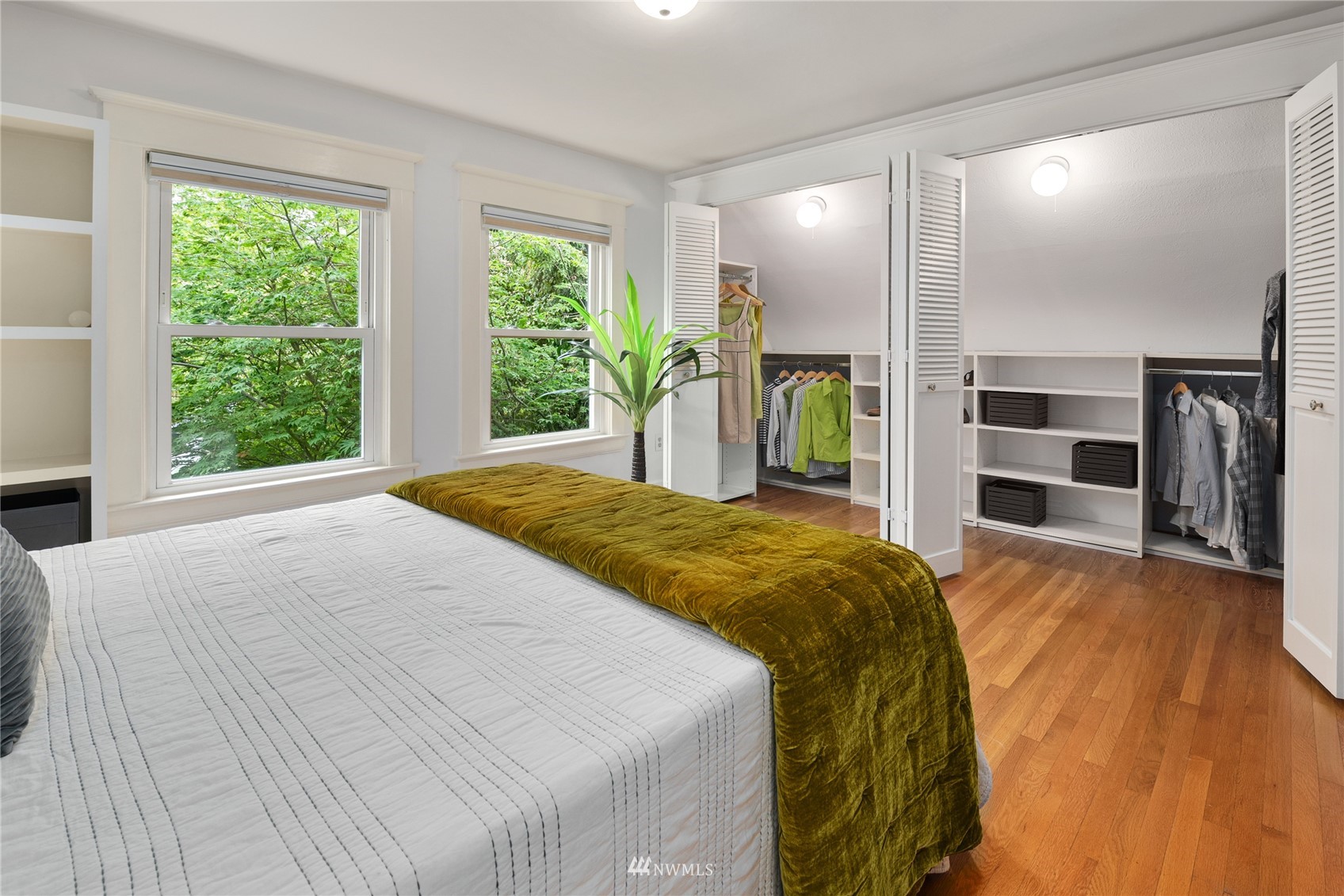 2419 2nd Avenue West Seattle, WA 98119 - Photo 13 of 30 a spacious bedroom with a bed and a large window