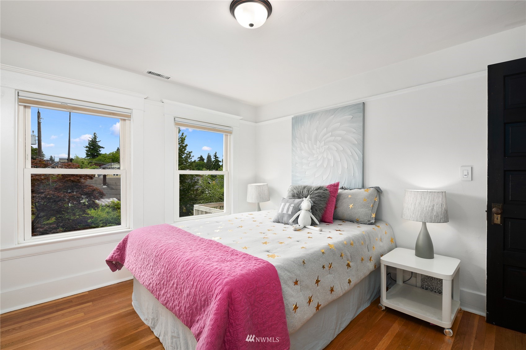 2419 2nd Avenue West Seattle, WA 98119 - Photo 15 of 30 a bedroom with a bed and window