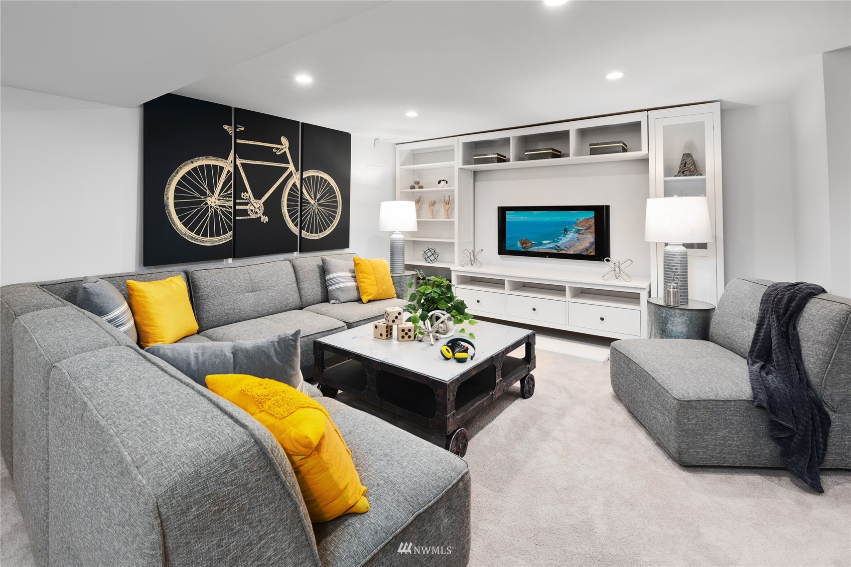 2419 2nd Avenue West Seattle, WA 98119 - Photo 16 of 30 a living room with furniture and a flat screen tv