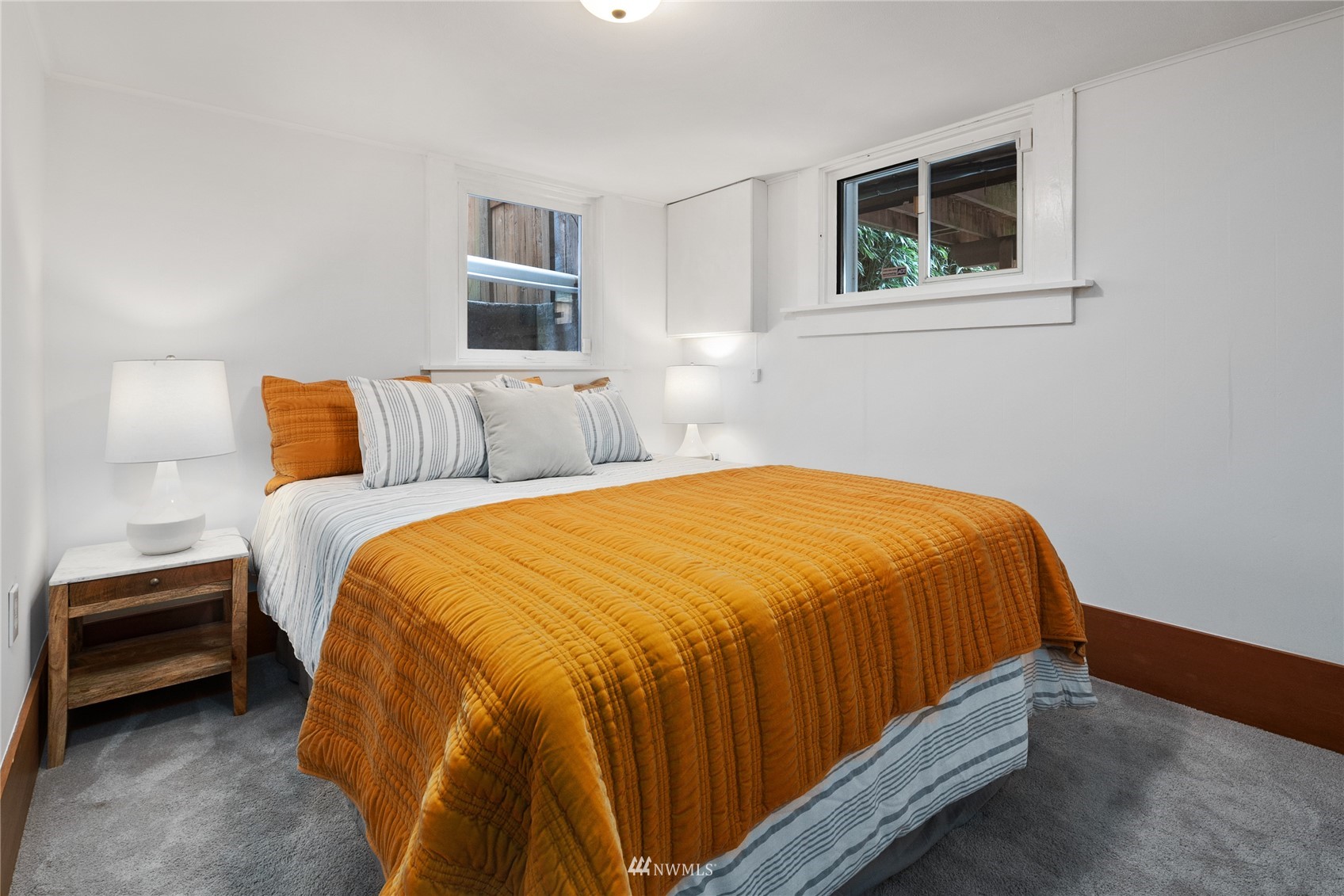2419 2nd Avenue West Seattle, WA 98119 - Photo 18 of 30 a bedroom with a bed and night stand