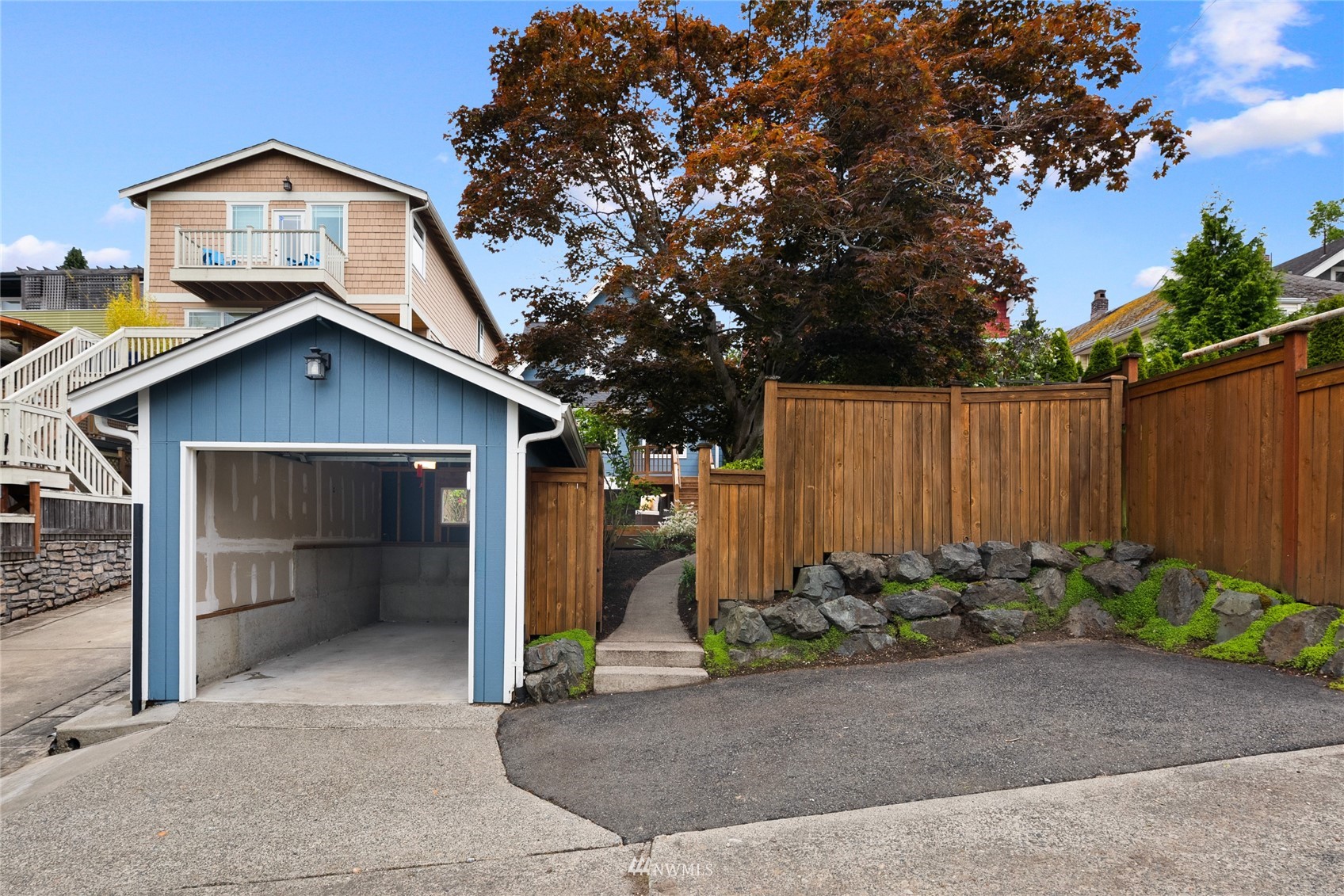 2419 2nd Avenue West Seattle, WA 98119 - Photo 25 of 30 a view of a house with potted plants