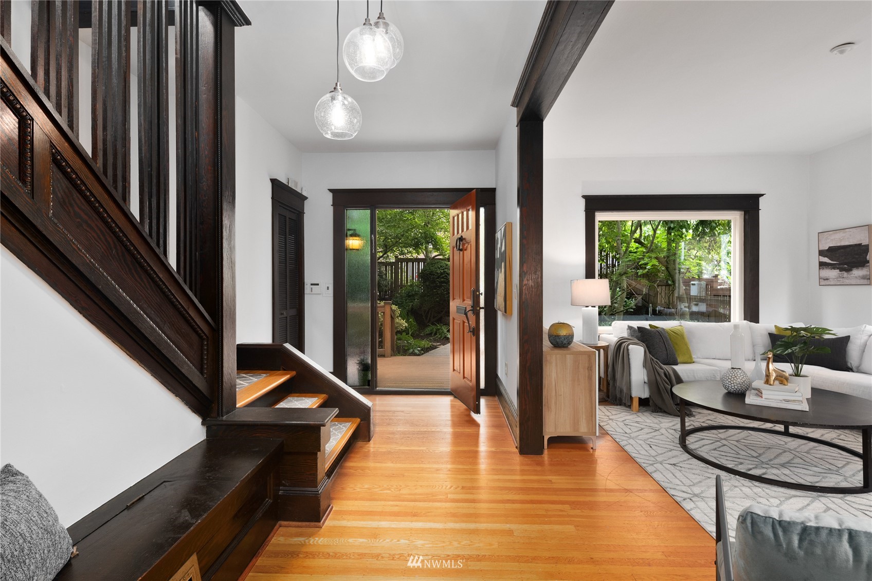 2419 2nd Avenue West Seattle, WA 98119 - Photo 4 of 30 a very nice looking living room with a large window and wooden floor