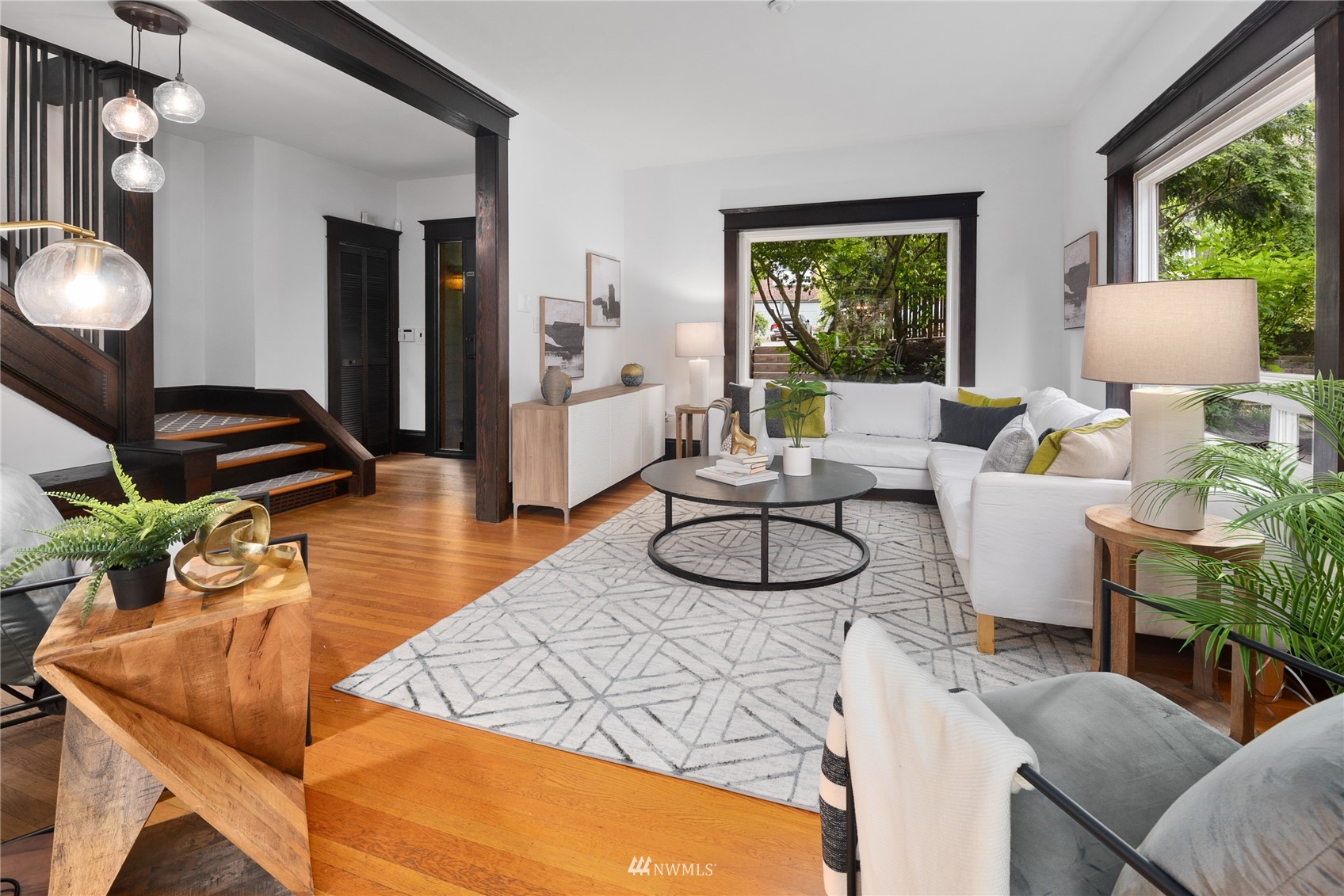 2419 2nd Avenue West Seattle, WA 98119 - Photo 5 of 30 a living room with furniture and a large window