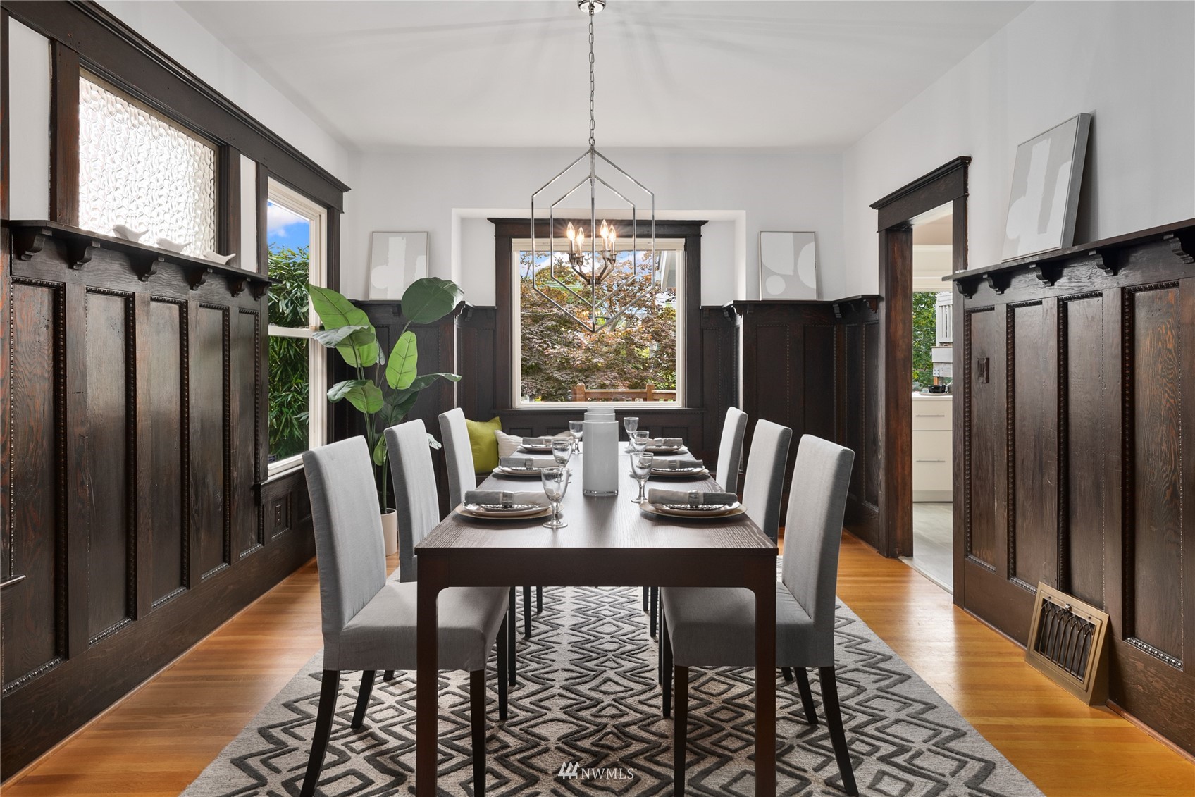 2419 2nd Avenue West Seattle, WA 98119 - Photo 7 of 30 a view of a dining room with furniture window and wooden floor