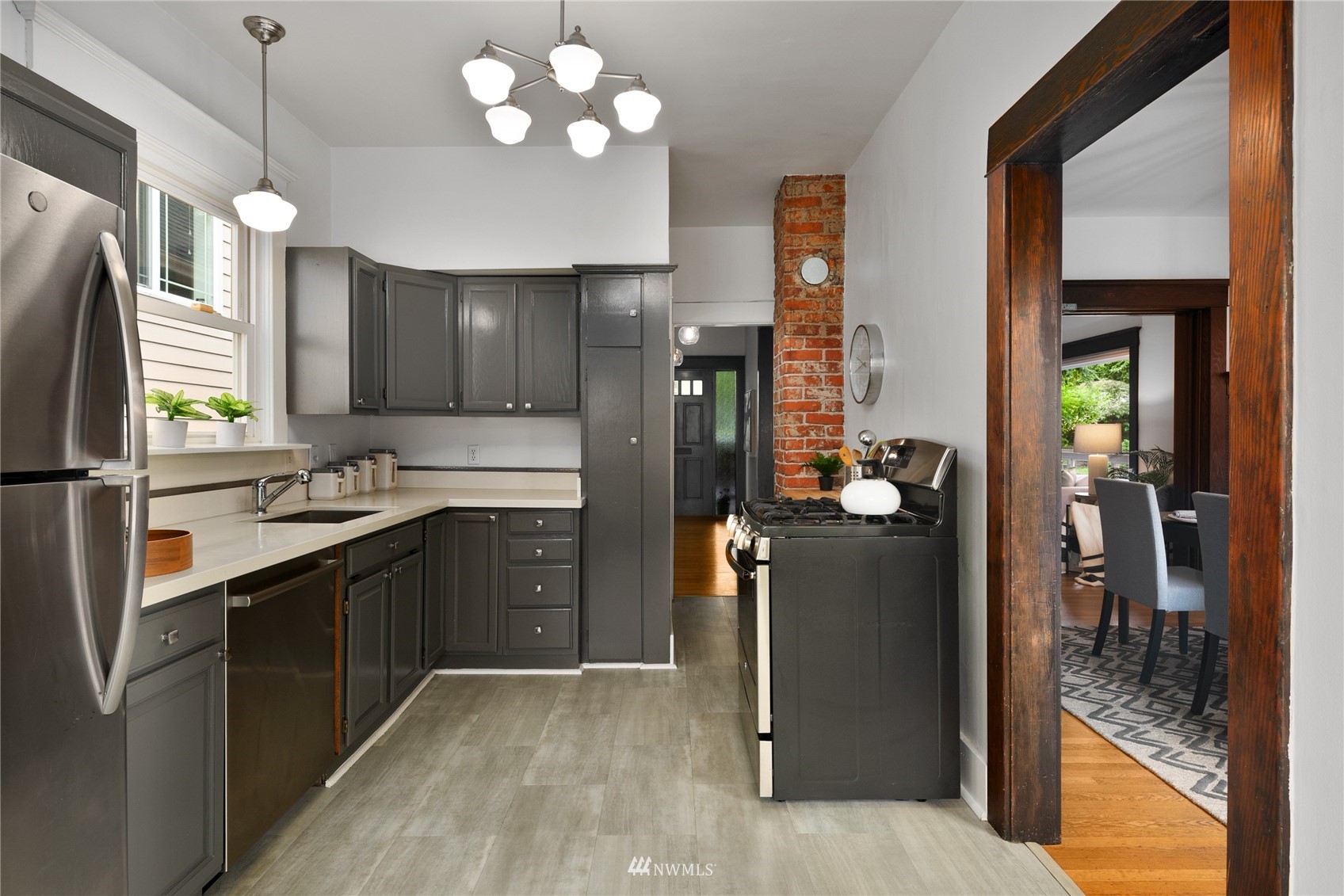2419 2nd Avenue West Seattle, WA 98119 - Photo 9 of 30 a kitchen with a refrigerator and a sink