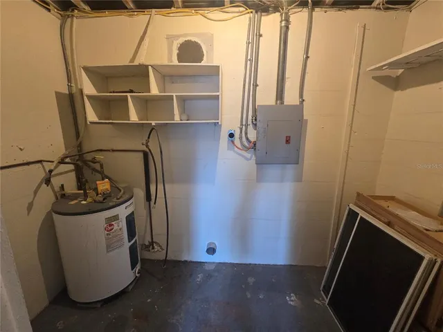 a view of storage and utility room with a sink