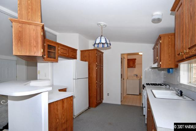 1476 Denali Court Reno, NV 89506 - Photo 3 of 5 a kitchen with refrigerator a sink a stove and a refrigerator
