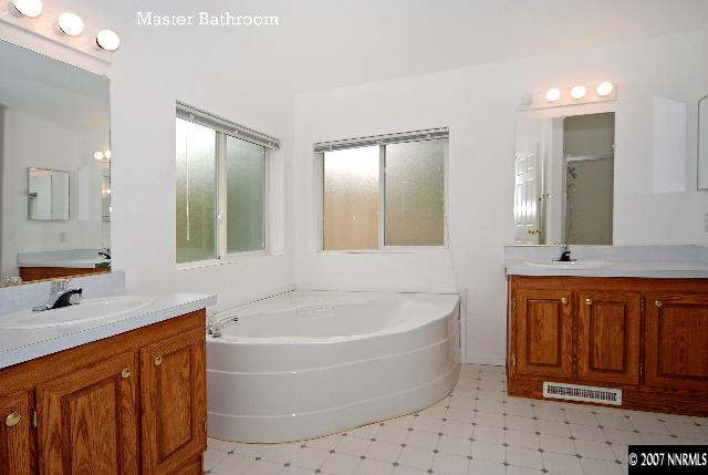 1476 Denali Court Reno, NV 89506 - Photo 4 of 5 a bathroom with a bathtub sink and mirror
