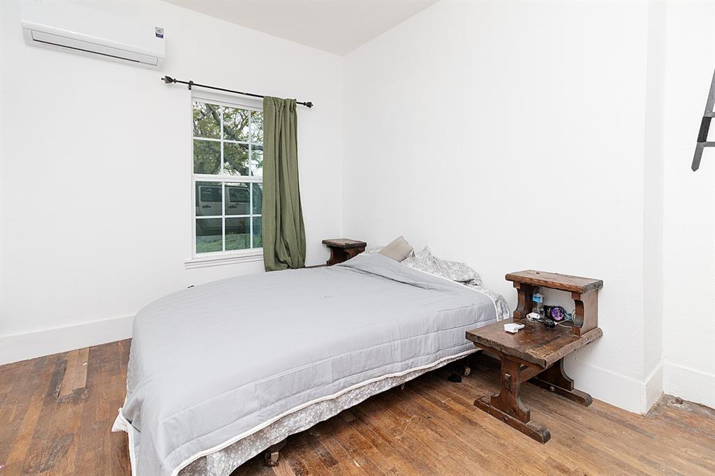 607 West 6th Street Brady, TX 76825 - Photo 15 of 32 a bedroom with a bed and a window