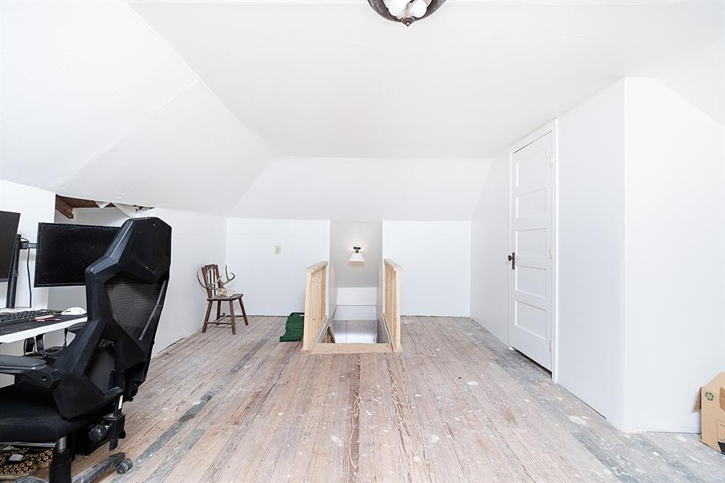 607 West 6th Street Brady, TX 76825 - Photo 20 of 32 a view of a workspace with furniture and wooden floor