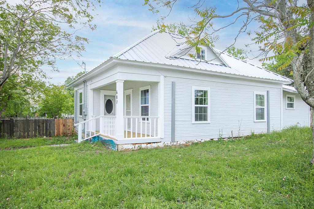 607 West 6th Street Brady, TX 76825 - Photo 2 of 32 a view of a house with a yard and wooden fence