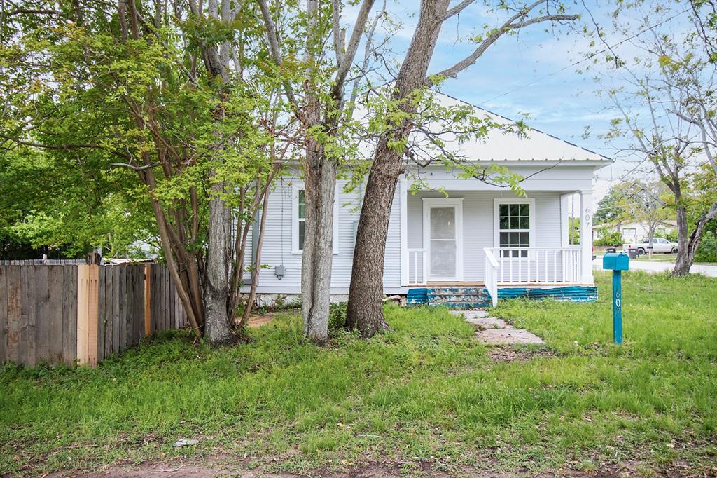 607 West 6th Street Brady, TX 76825 - Photo 27 of 32 a view of a house with backyard and a tree