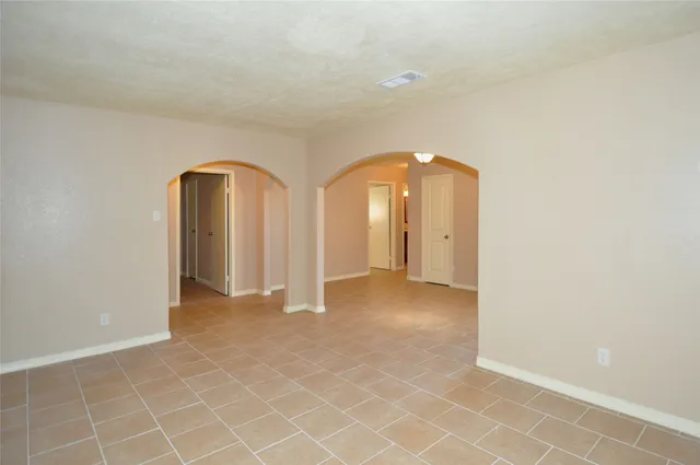 an empty room with glass door