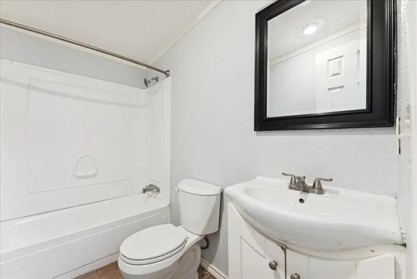 a bathroom with a sink a mirror and a toilet