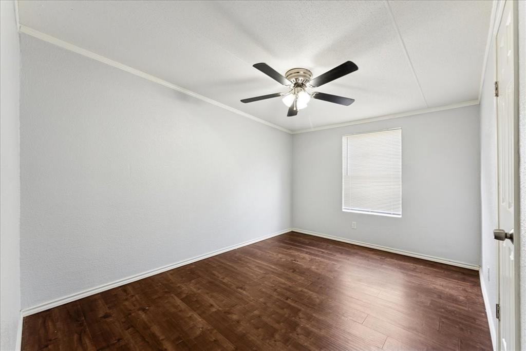 107 Hidden View Court Springtown, TX 76082 - Photo 19 of 24 an empty room with a window and a fan