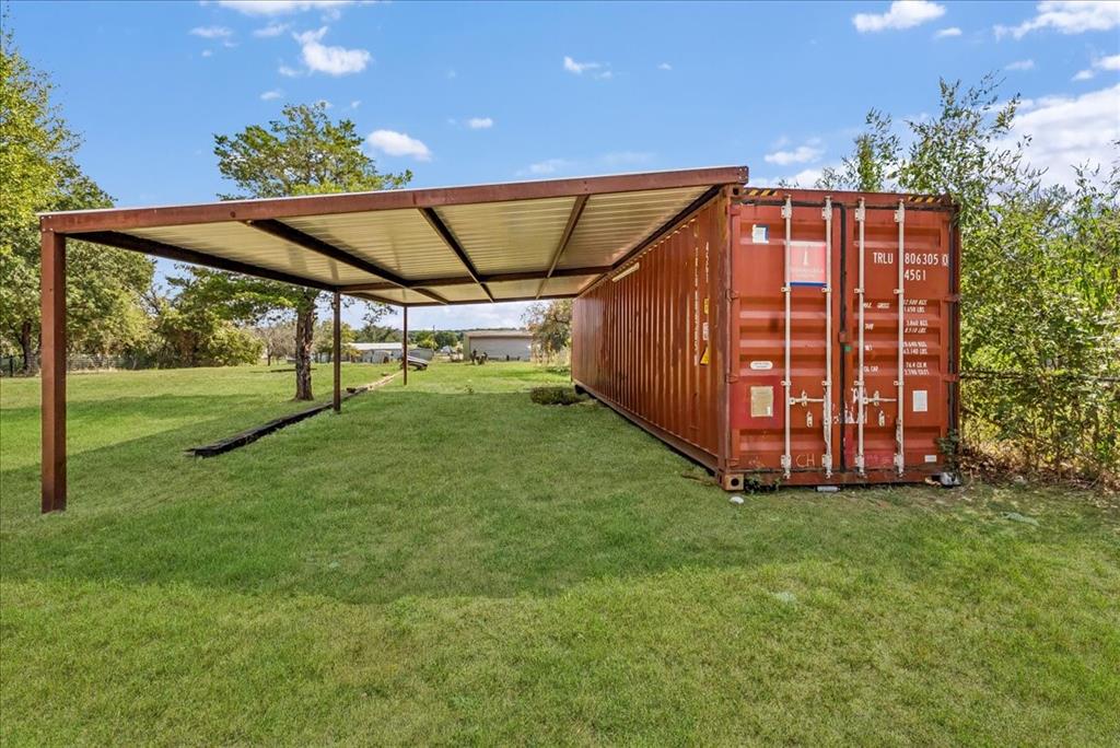 107 Hidden View Court Springtown, TX 76082 - Photo 21 of 24 a view of a backyard with garden and deck