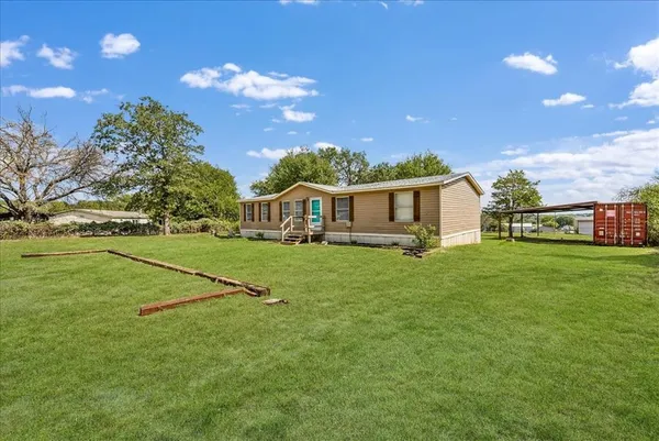 a view of a house with a big yard