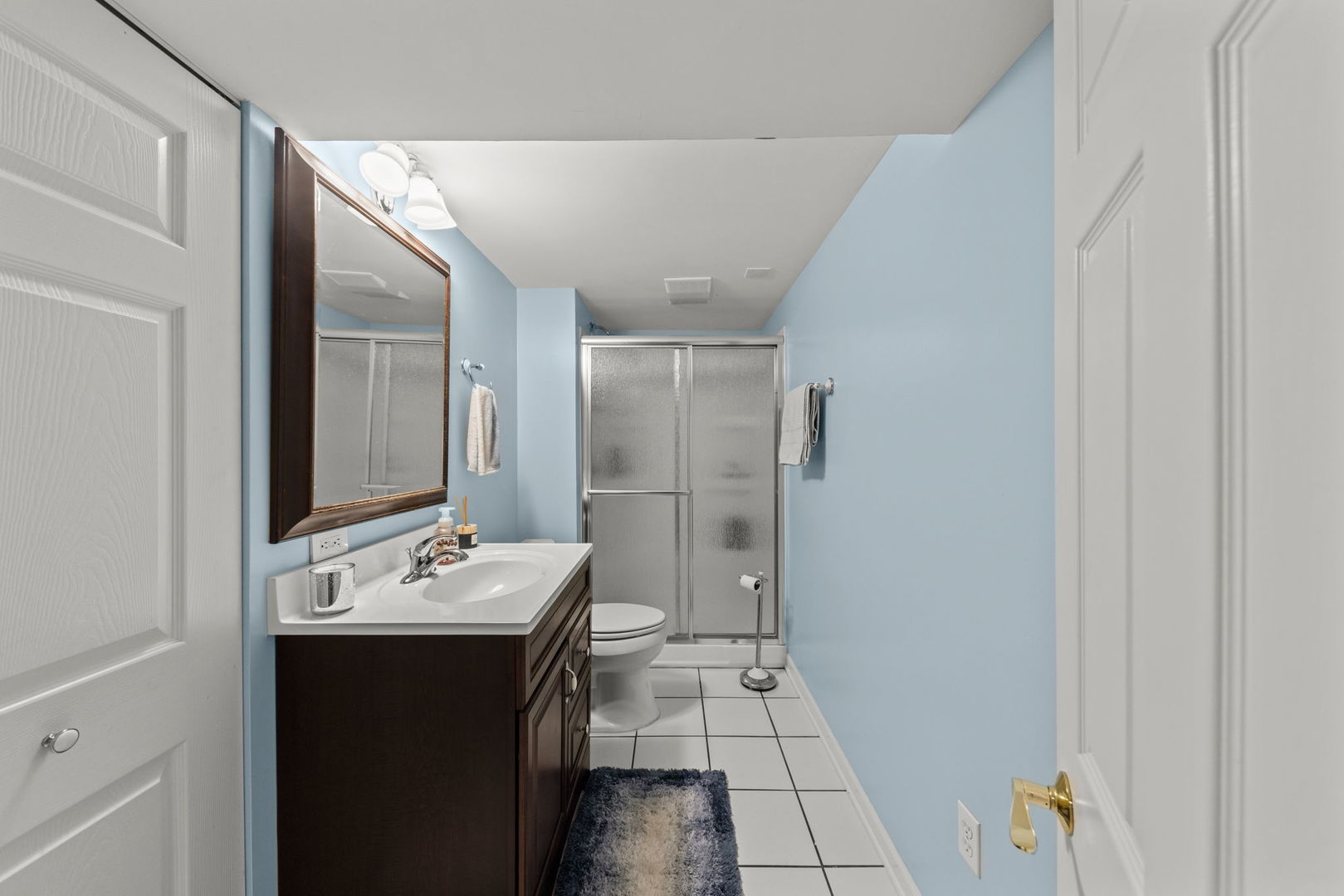 49 Old Post Road Montgomery, IL 60538 - Photo 21 of 31 a bathroom with a sink a toilet and mirror