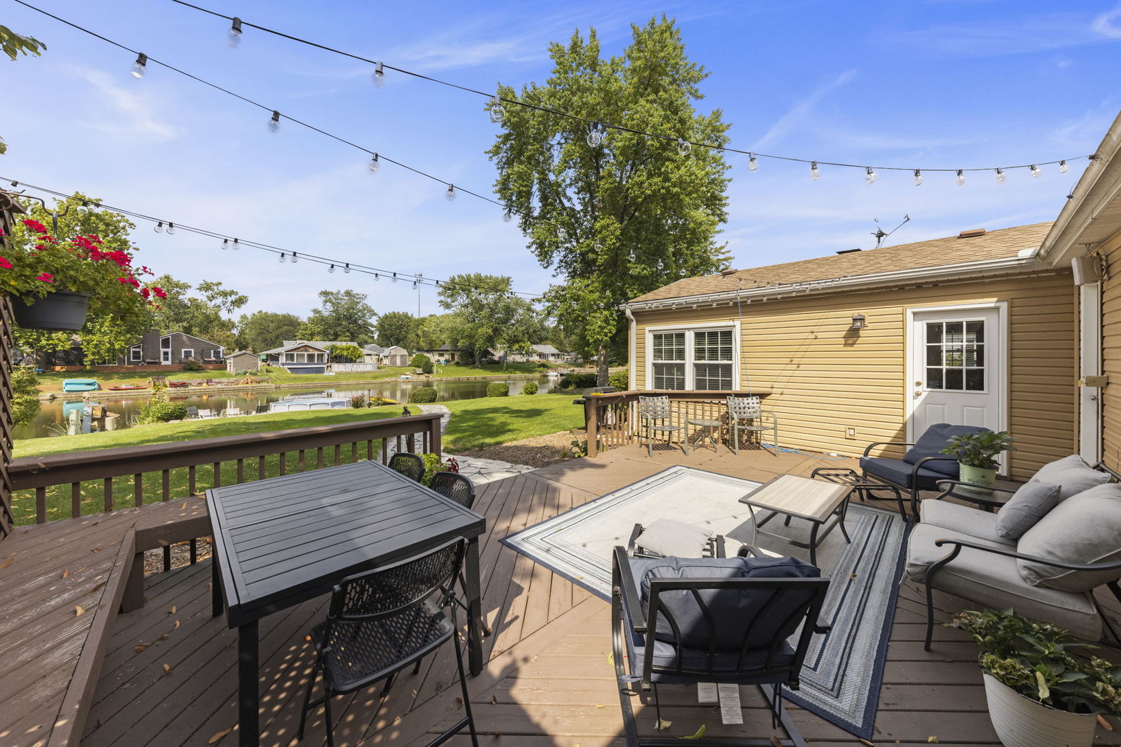 49 Old Post Road Montgomery, IL 60538 - Photo 22 of 31 a view of a patio with table and chairs and potted plants