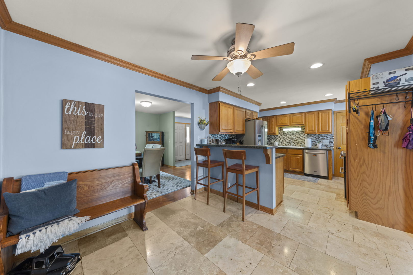 49 Old Post Road Montgomery, IL 60538 - Photo 5 of 31 a living room with stainless steel appliances kitchen island granite countertop furniture and a view of kitchen