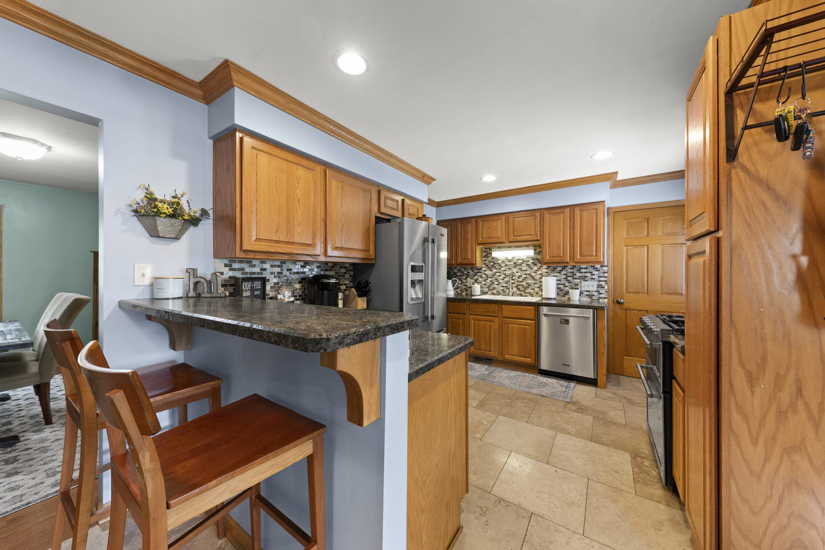 49 Old Post Road Montgomery, IL 60538 - Photo 7 of 31 a kitchen with a table and chairs in it