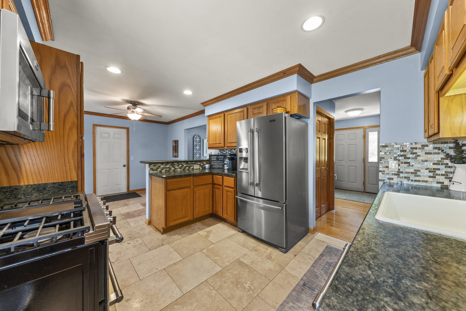 49 Old Post Road Montgomery, IL 60538 - Photo 9 of 31 a kitchen with stainless steel appliances granite countertop a refrigerator and a stove