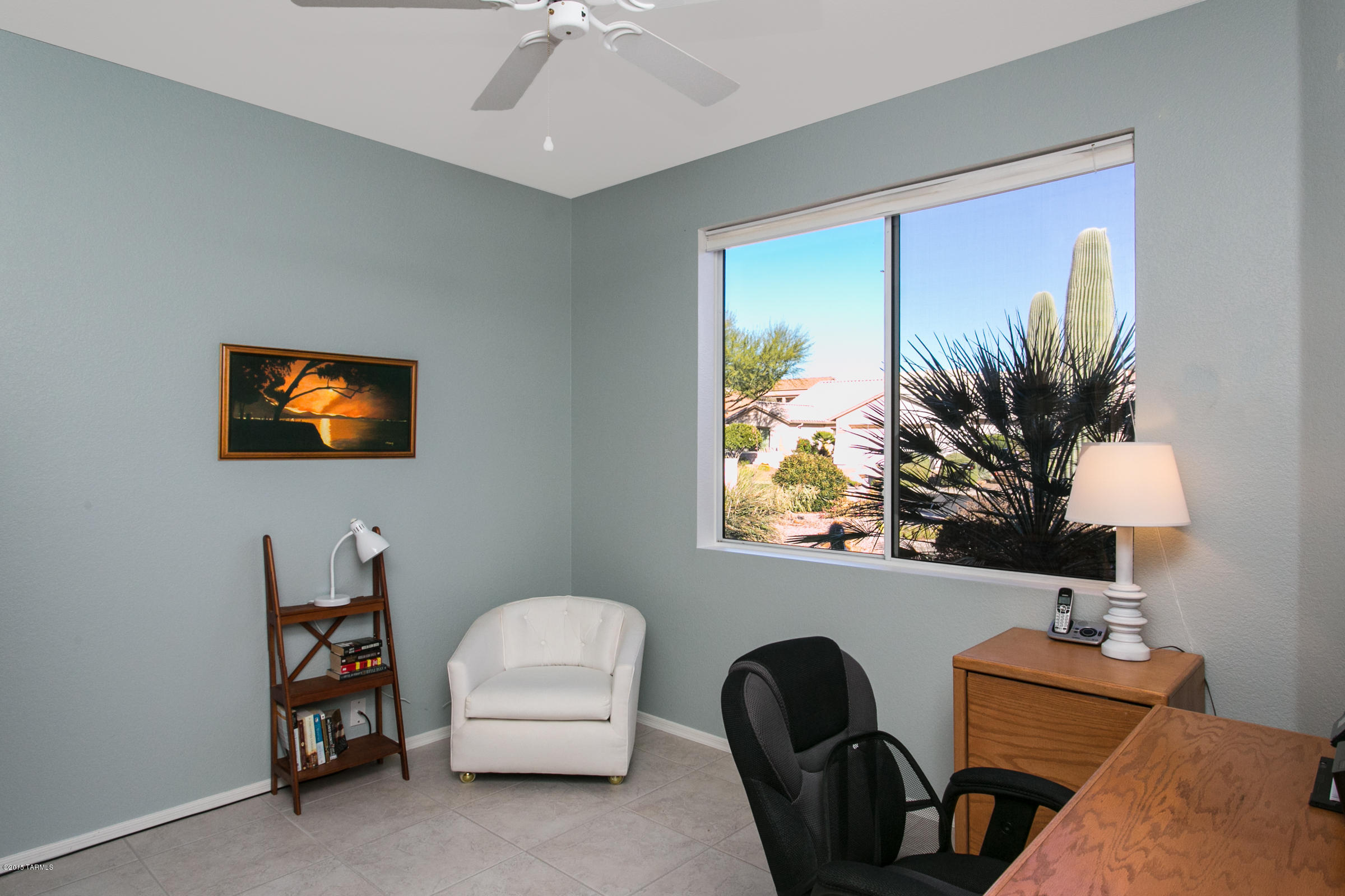 62419 East Northwood Road Tucson, AZ 85739 - Photo 23 of 30 a living room with furniture and a flat screen tv