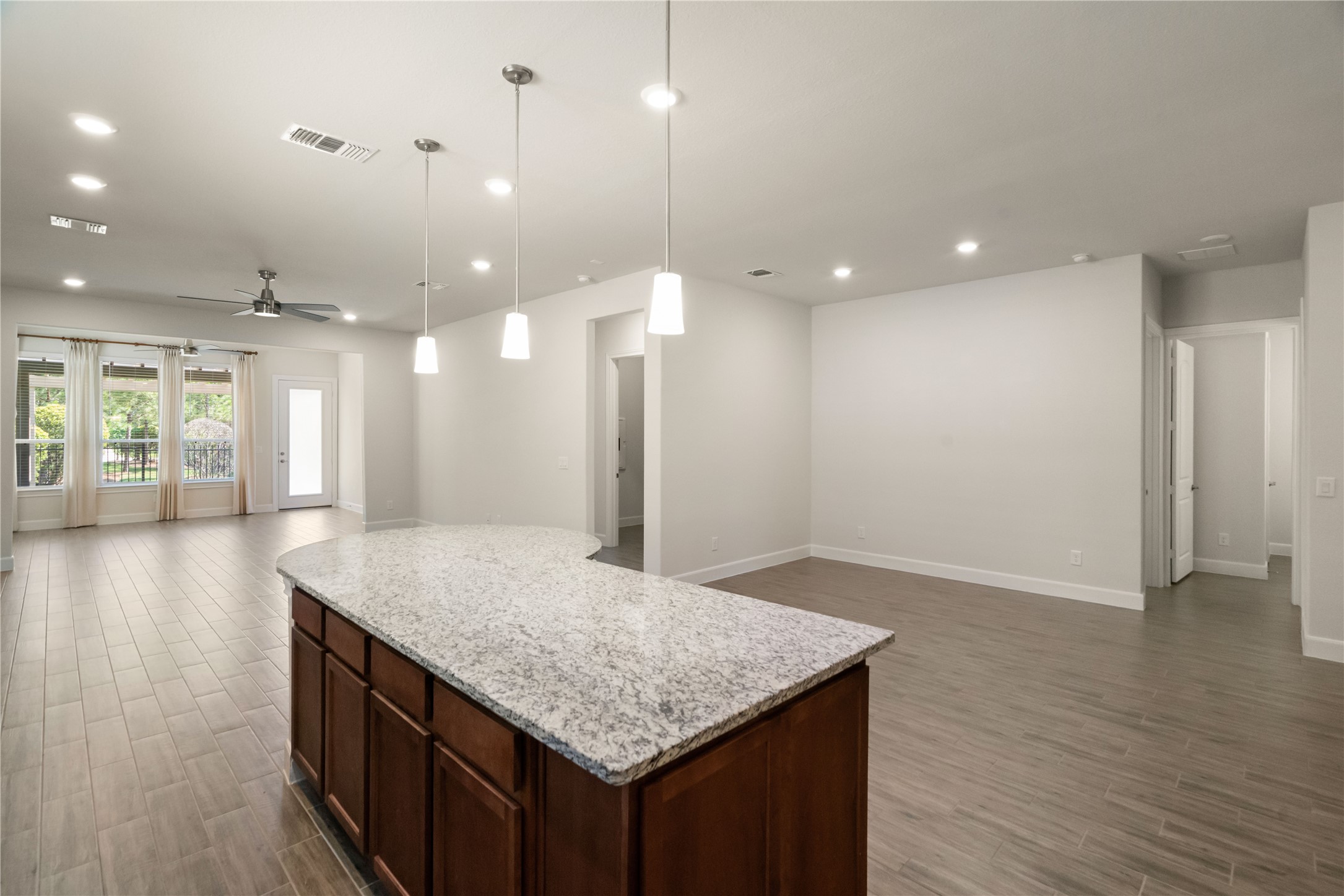 516 Nokota Drive Spring, TX 77382 - Photo 9 of 33 Abundant space in this beautifully designed home. Upgraded tile throughout creates a clean and cohesive look. So many options for the dining area and plenty of wall space for beautiful art. Look at that beautiful green space through the windows!