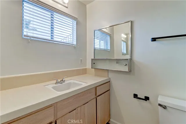 a kitchen with a sink cabinets and window