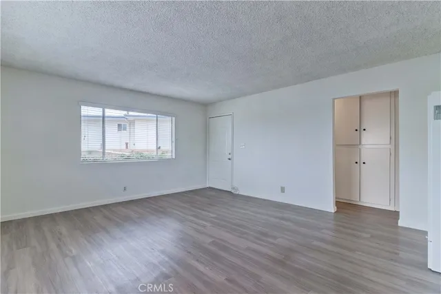 a kitchen with a sink cabinets and window