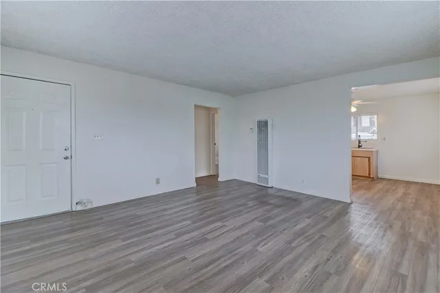 a kitchen with cabinets appliances a sink and a window