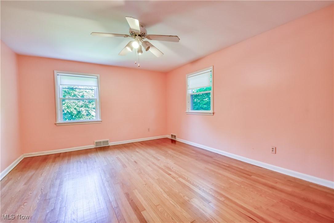 2607 Ashurst Road University Heights, OH 44118 - Photo 30 of 39 Spare room featuring healthy amount of natural light, light wood-type flooring, and a ceiling fan