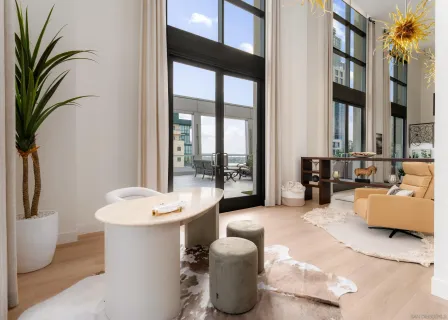 a living room with furniture and a large window