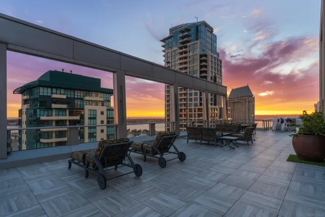 a kitchen with kitchen island a counter top space a sink stainless steel appliances and cabinets