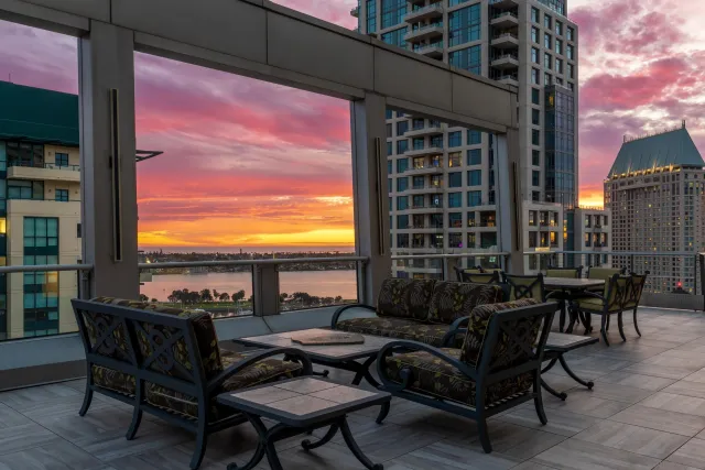 a kitchen with stainless steel appliances granite countertop a sink and a refrigerator