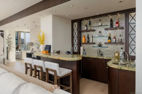 a large kitchen with lots of counter space and windows