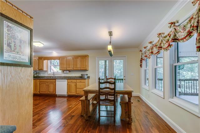 2047 Ridgeview Run Lynchburg, TN 37352 - Photo 3 of 20 The dining room area is convenient to the kitchen, open to the living area and next to the huge screened in deck overlooking the lake!!
