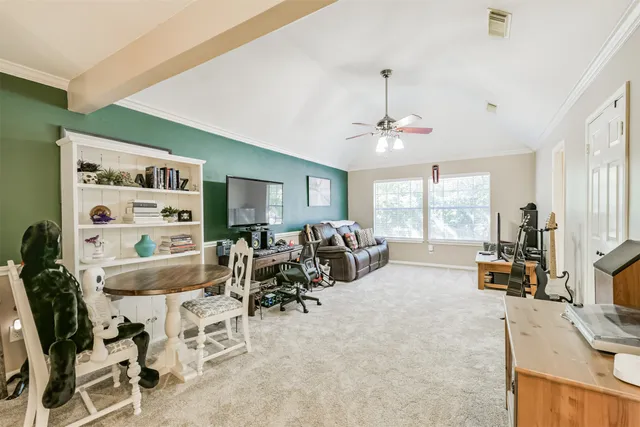 a bedroom with furniture a bed and a chandelier