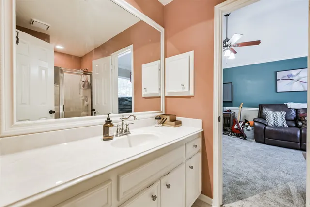 an aerial view of a house with a swimming pool