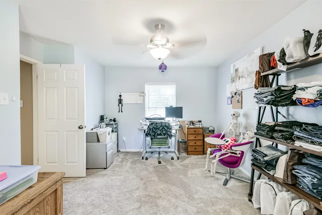 front view of a brick house with a yard