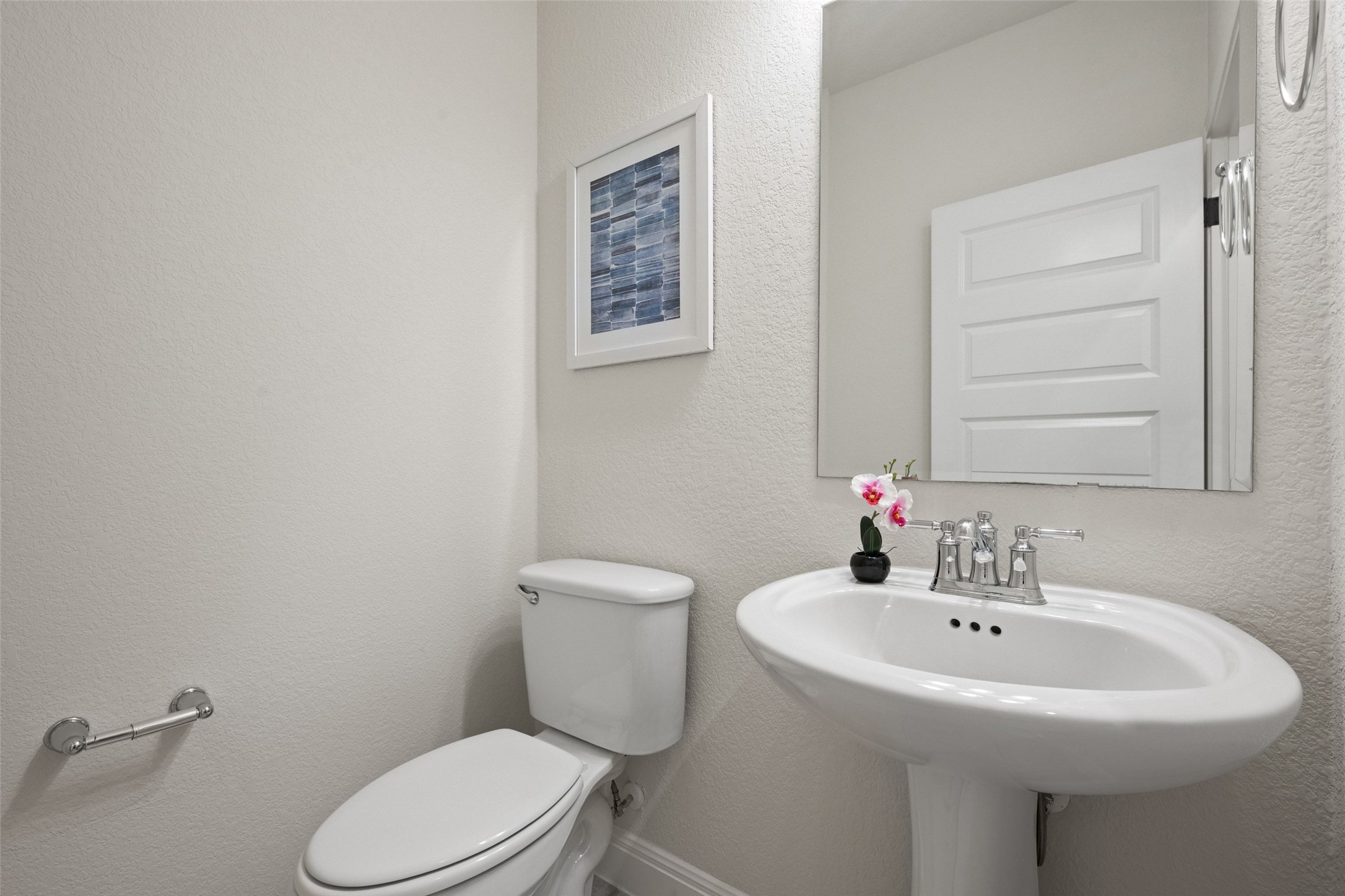 1513 Hinterwald Street Leander, TX 78641 - Photo 32 of 40 a bathroom with a sink a toilet and mirror