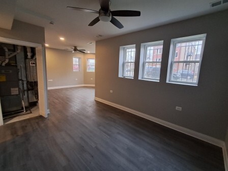 935 West Marquette Road, Unit GARDEN Chicago, IL 60621 - Photo 16 of 25 a view of an empty room with wooden floor and a window